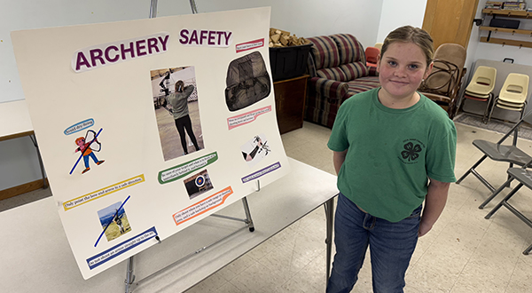 4-her with 4-h day exhibit for archery safety